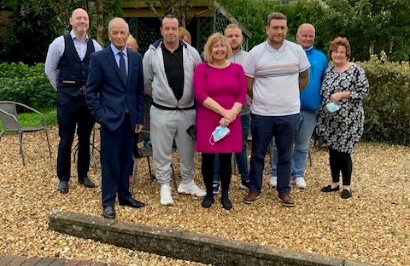 Dr Altaf Hussain pictured with Deputy Minister Lynne Neagle with staff and supporters at the Brynawel Drug and Alcohol rehabilitation centre at Llanharan