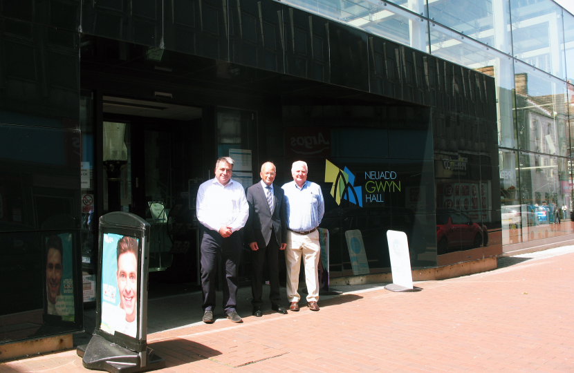 Altaf Hussain, centre, poses outside the Gwyn Hall with Mr Collins, left and Coun Peters, right.