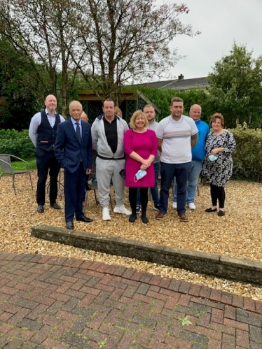 Dr Altaf Hussain pictured with Deputy Minister Lynne Neagle with staff and supporters at the Brynawel Drug and Alcohol rehabilitation centre at Llanharan